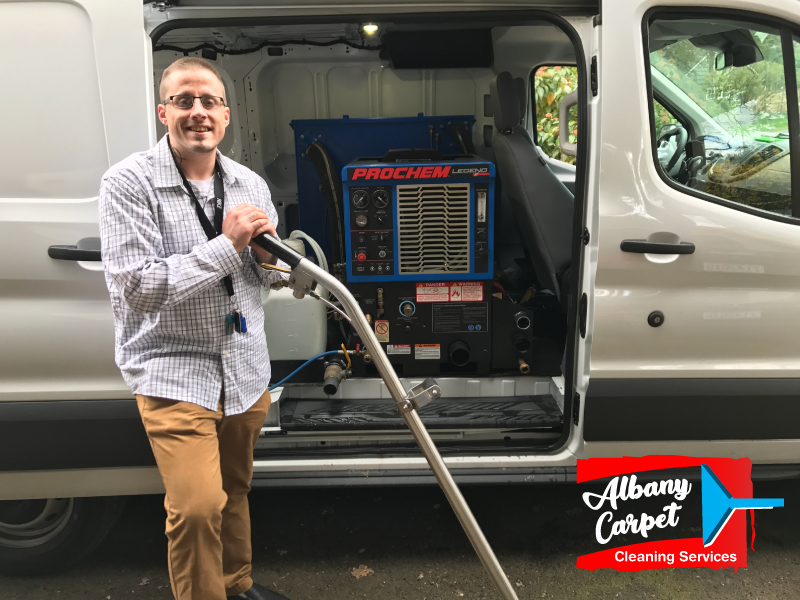 man-standing-near-move-in-and-move-out-carpet-cleaning-van